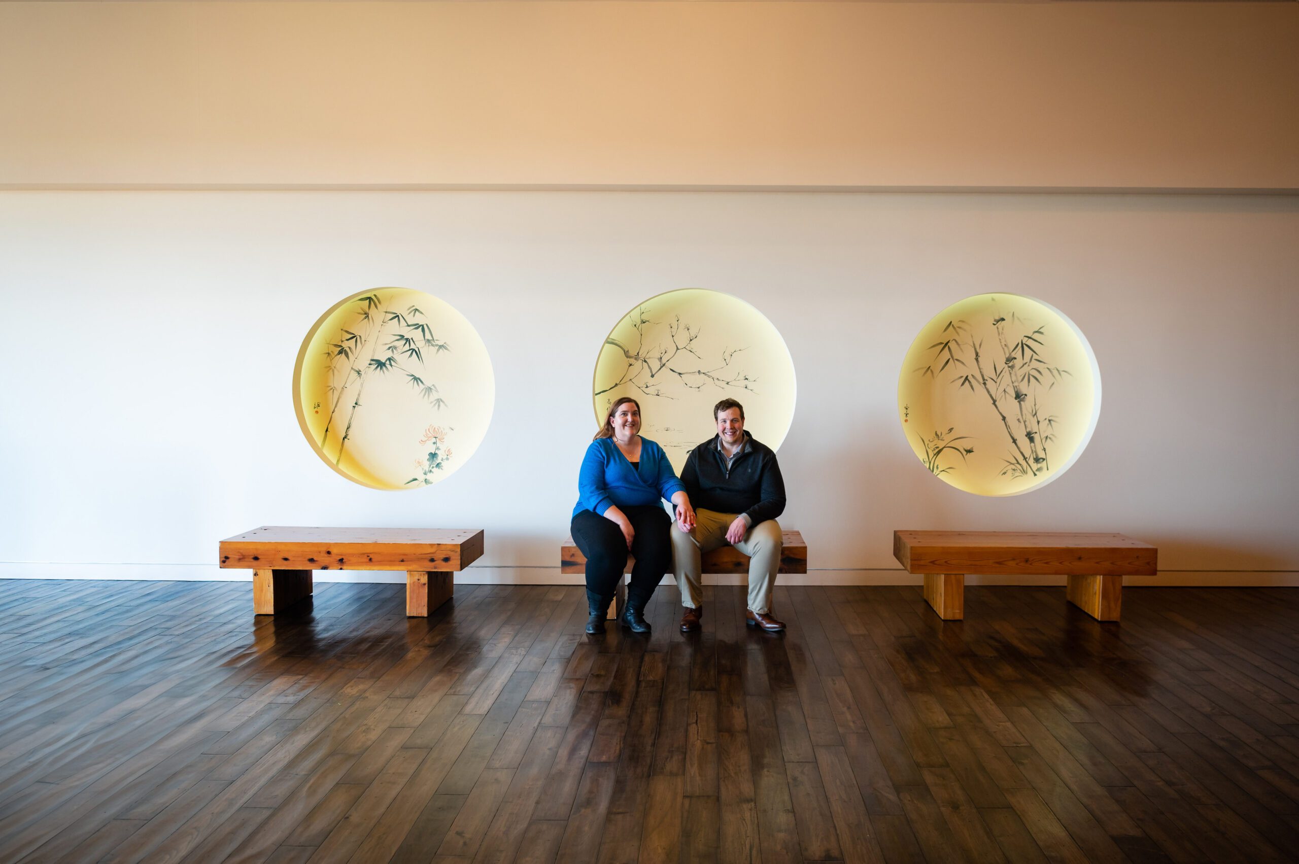 Carly and Dustin smiling during their indoor engagement session at the Epic Systems Campus in Verona, Wisconsin.