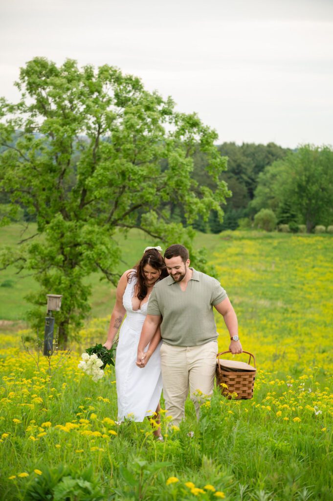 pope-farm-middleton-wi-engagement-couple-walking-picnic-basket