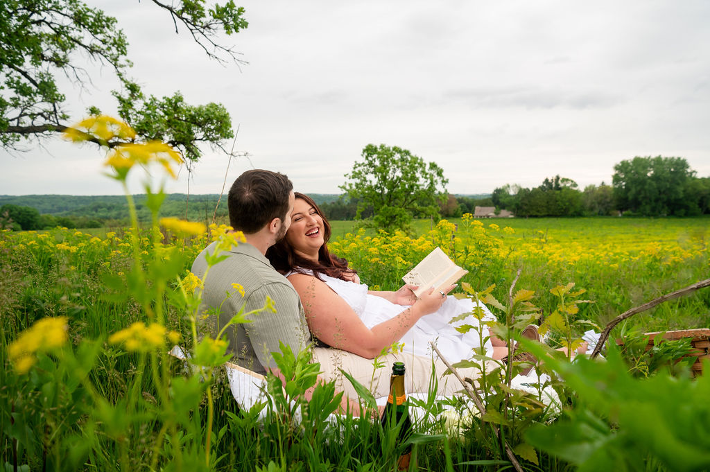 romantic-french-picnic-engagement-couple-reading-pope-farm-middleton-wisconsin