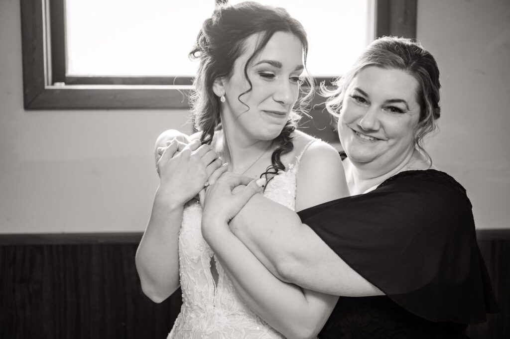 Bride getting ready with mom at Wisconsin home before wedding