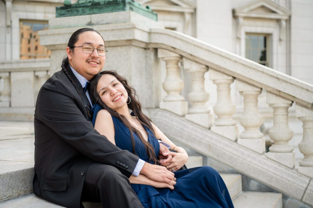 Autumn and Michael embracing on the steps of the Wisconsin State Capitol