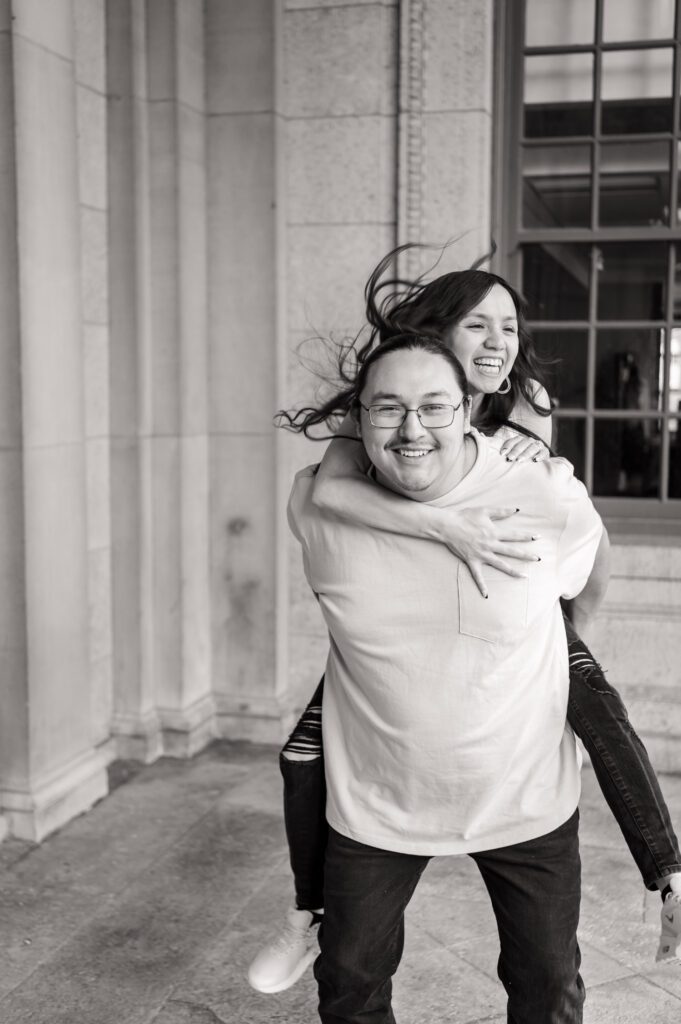 Autumn and Michael laughing on the steps of the Wisconsin State Capitol
