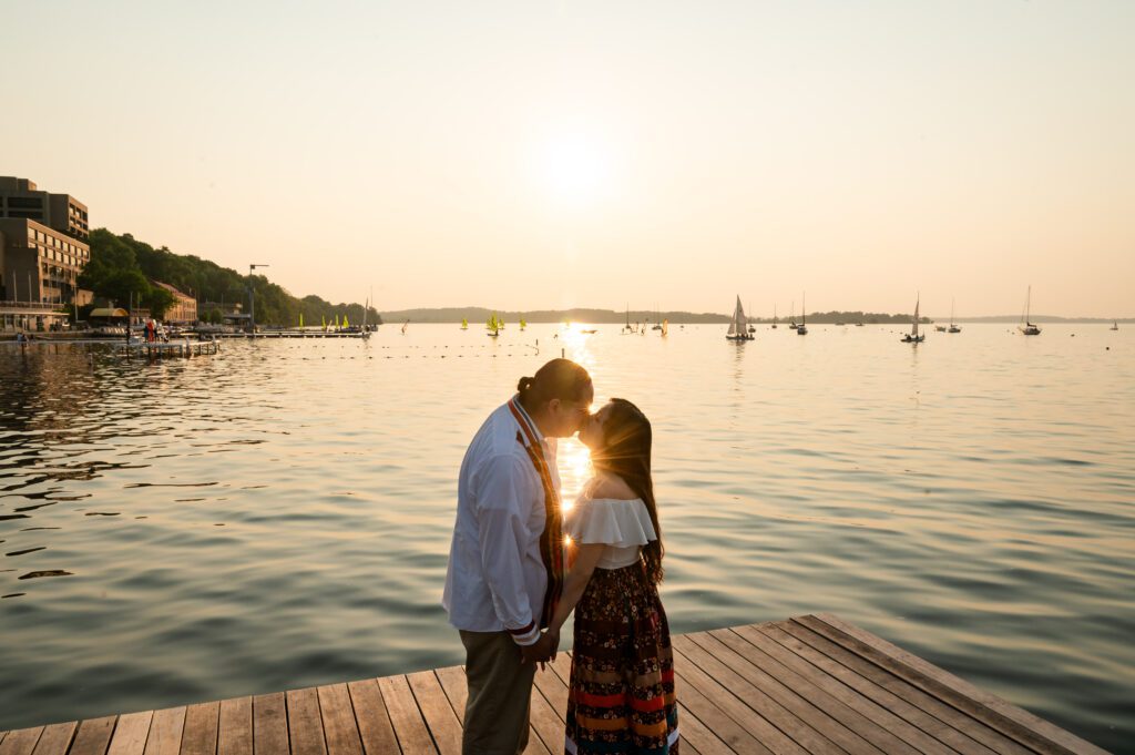 Engagement portraits on the Memorial Union Terrace with Lake Mendota in the background