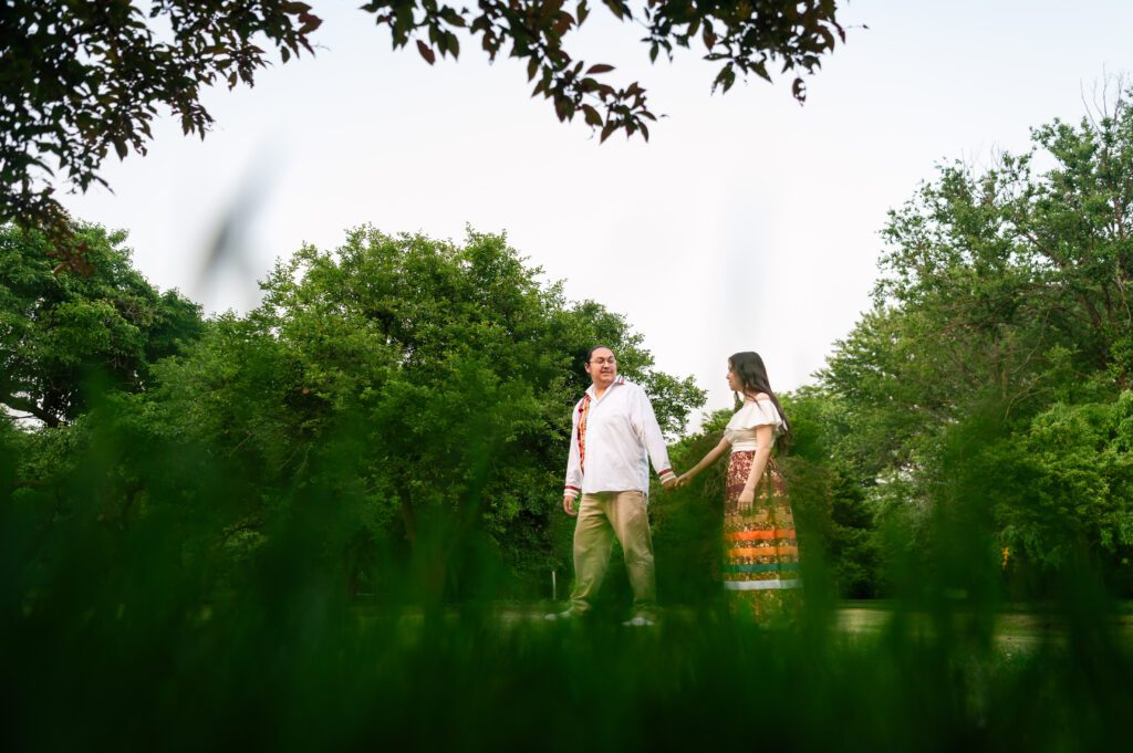 Couple walking through the UW Arboretum trails in matching ribbon outfit