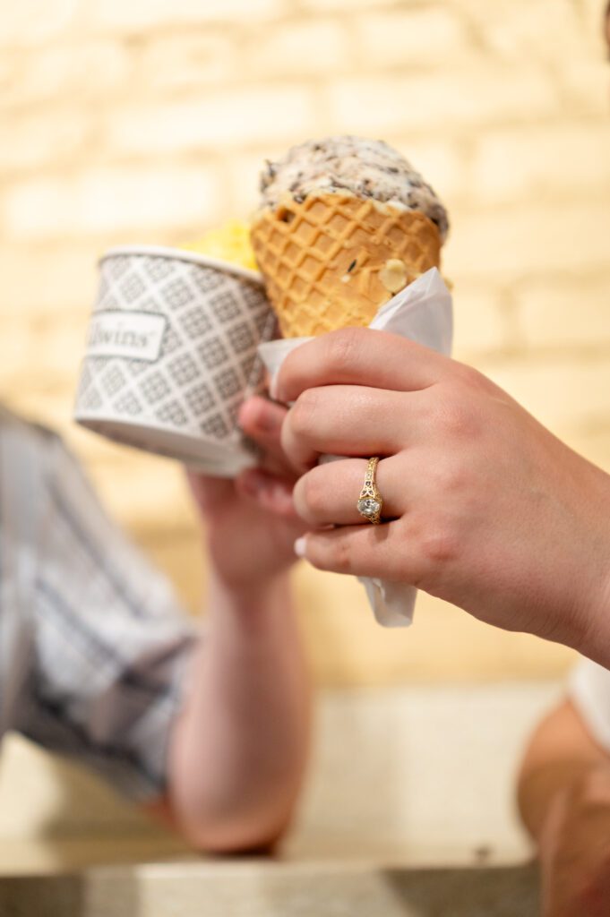 Couple sharing ice cream cone at Kilwins in downtown Madison