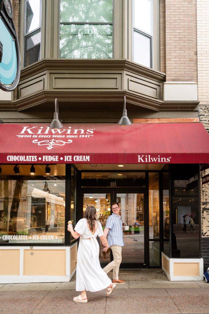Romantic Engagement photos at Kilwins in downtown Madison