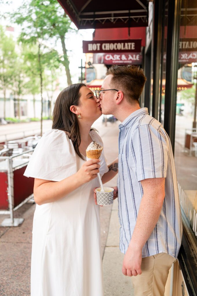 Couple sharing ice cream cone at Kilwins in downtown Madison