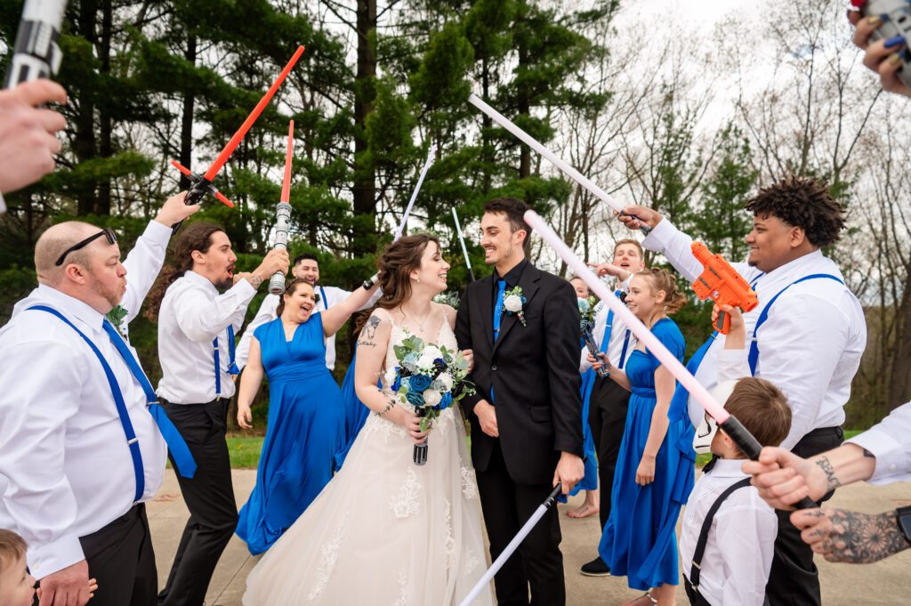 Groomsmen with lightsabers at Deerfield Rod and Gun Club wedding