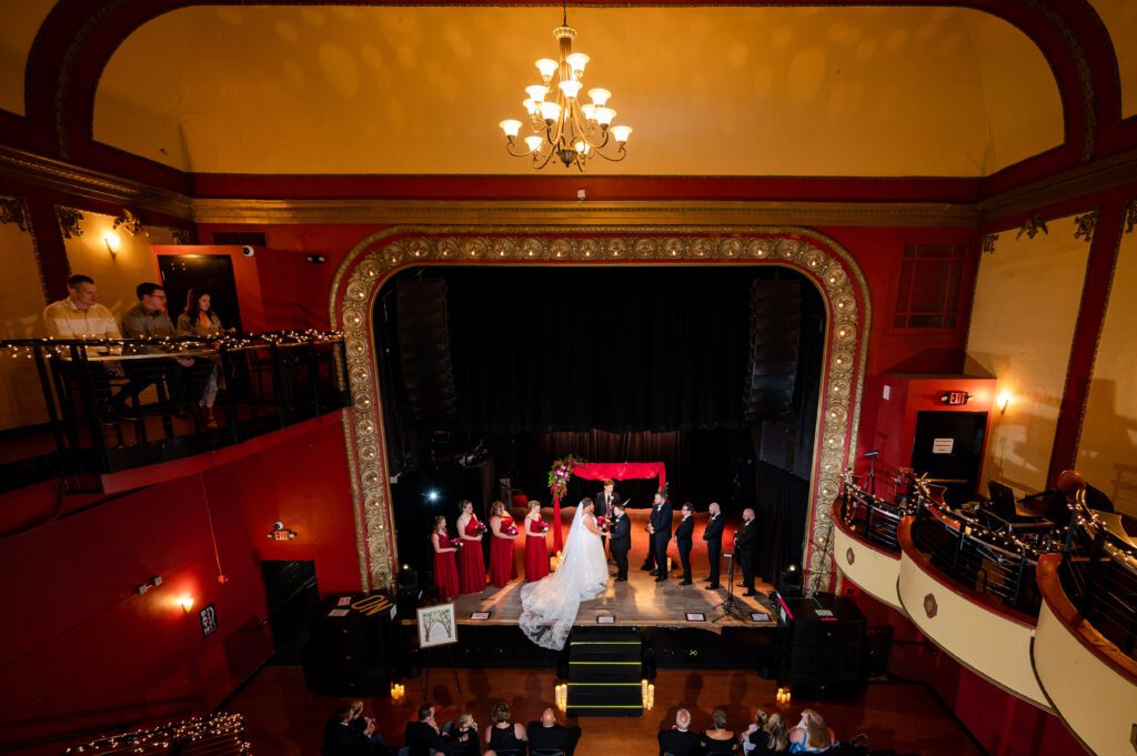 Bride and groom sharing a moment on stage at Majestic Theatre Madison
