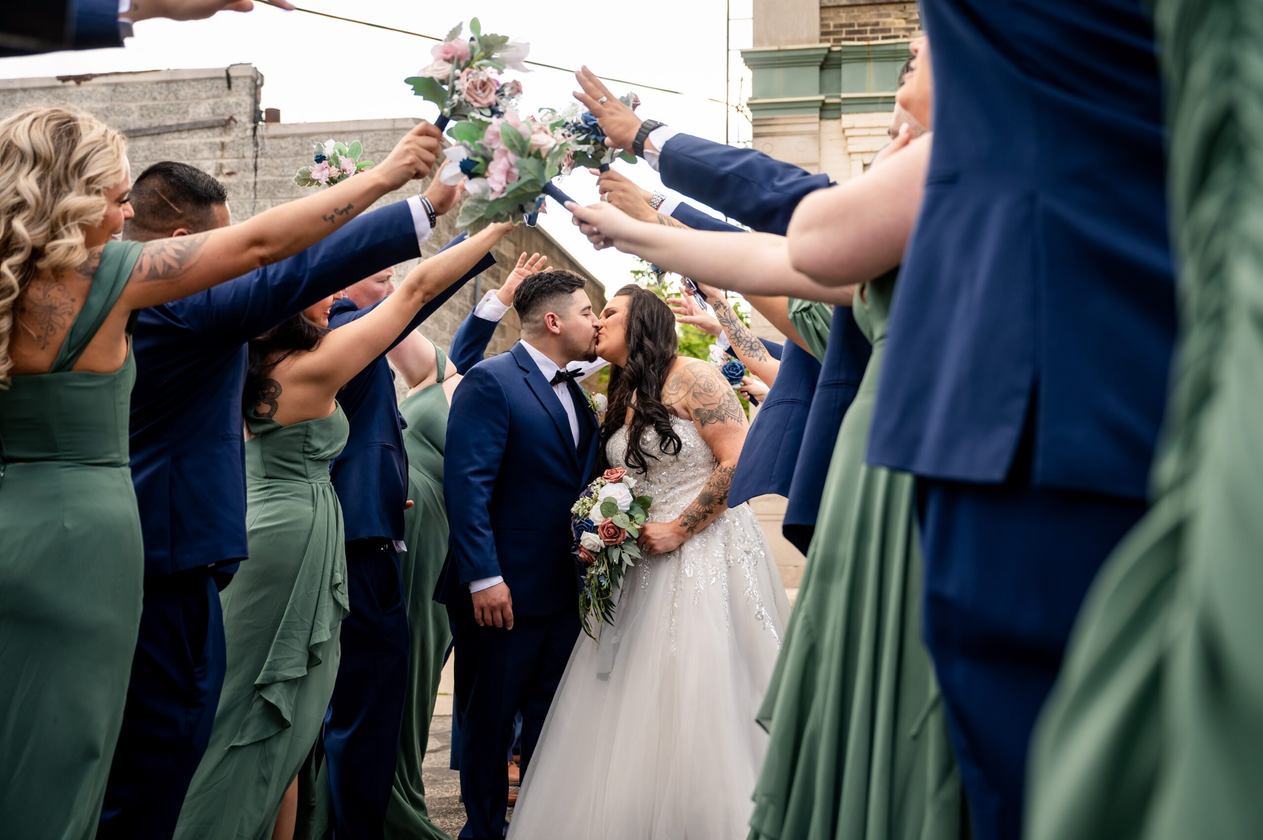 Close-up of the bride and groom sharing a kiss filled with love and joy.