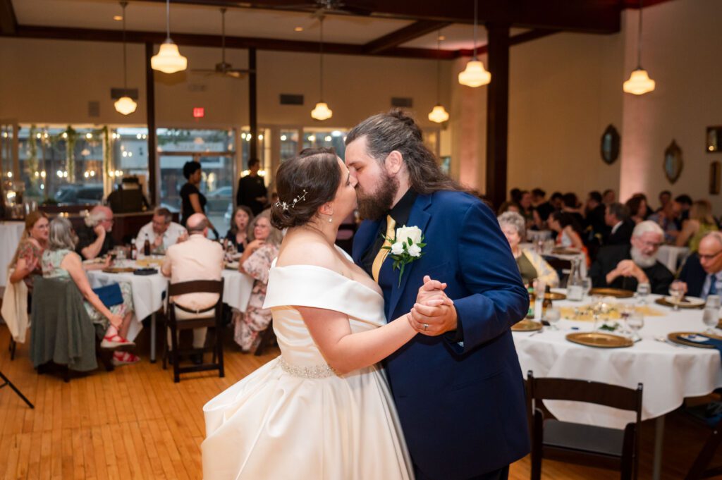 Bride Marissa and groom Jared share their first dance and a kiss at their Dungeons & Dragons themed wedding reception in Stoughton, WI.